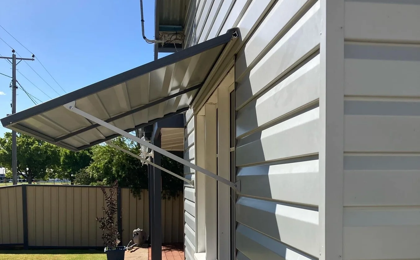 Steel window awning by Picton Bros Panelspan shading a window on a cladded home